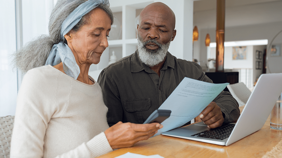 old couple looking at papers